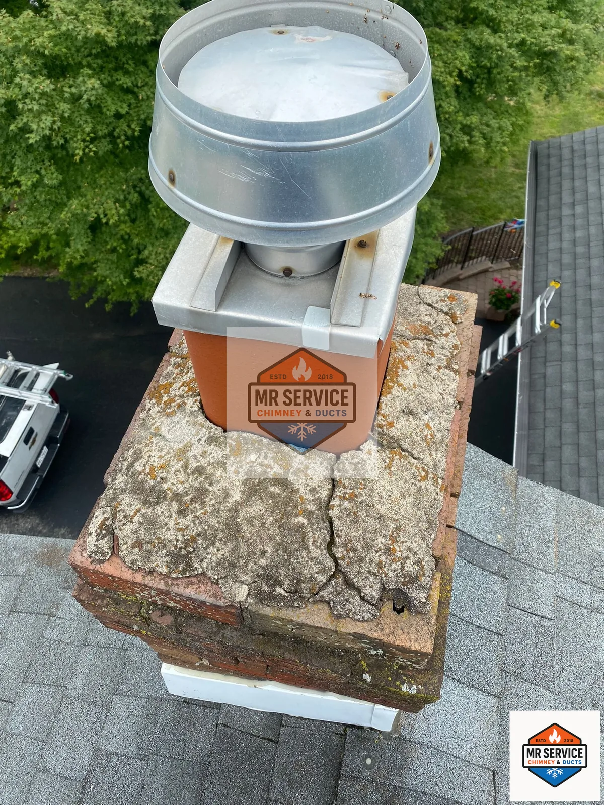 Cracked and weathered chimney crown before repair