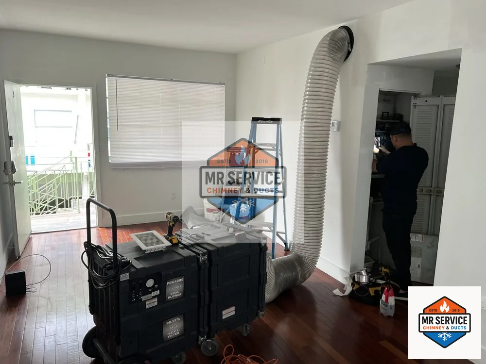 Duct cleaning equipment and hose staged inside a home