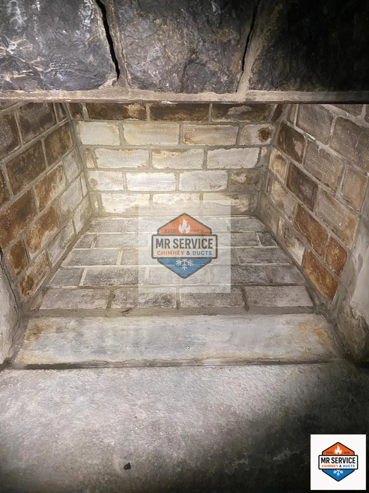 Cleaned firebox interior with brick surfaces visible